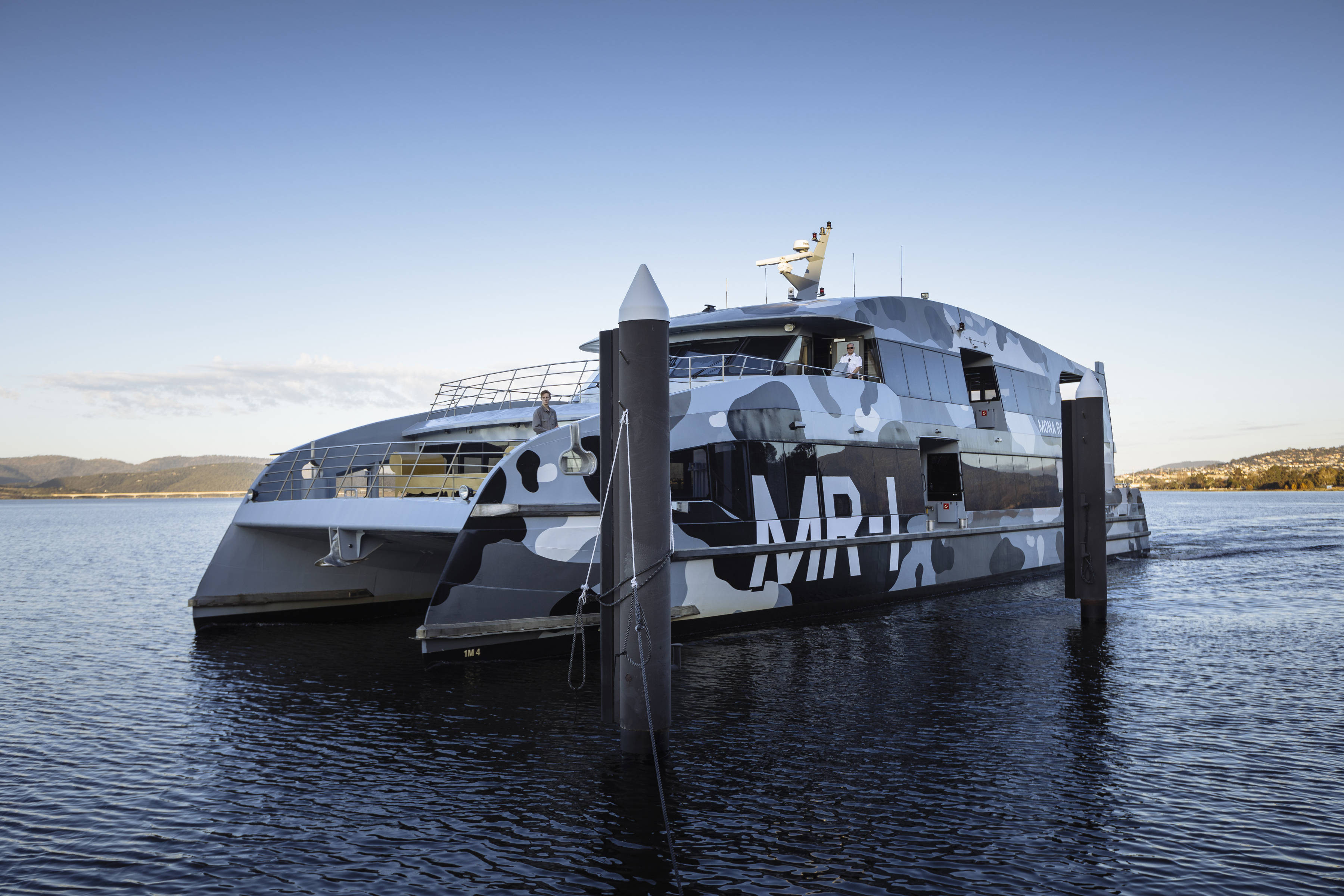 The Mona Roma ferry, MR-I, featuring blue and grey camouflaged exterior, on the River Derwent.